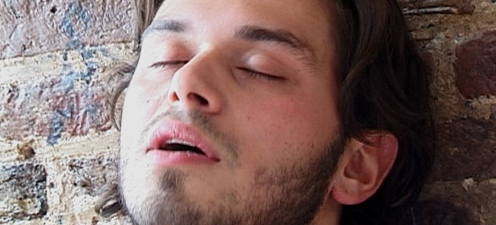 Chris Brinkhof closing his eyes in ecstasy in Headshot, an erotic film directed by Jennifer Lyon Bell for Blue Artichoke Films